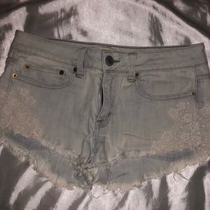 Denim shorts with flower lace on sides